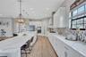 Sonoma Linen cabinets, Calacatta Novello Quartz counter-tops, Floorte Pride Plus Riverside LVP