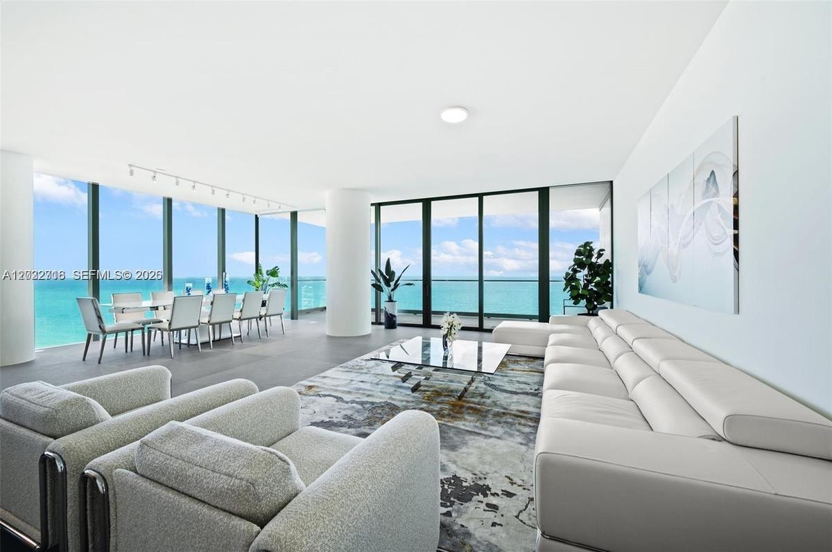 Direct ocean views from the spacious living area with floor-to-ceiling glass.