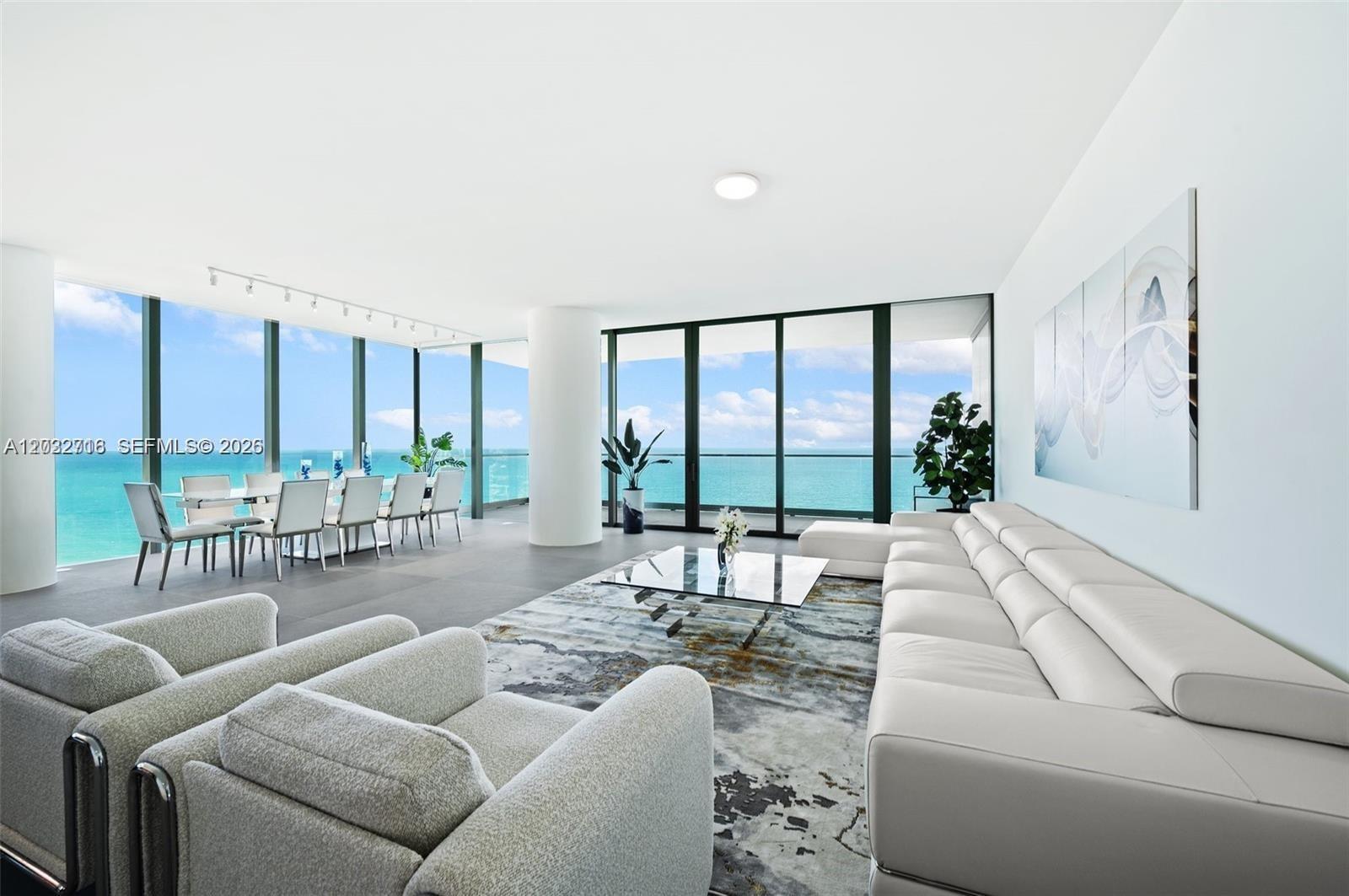 Direct ocean views from the spacious living area with floor-to-ceiling glass.