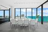 Direct ocean views from the spacious ldining area with floor-to-ceiling glass.