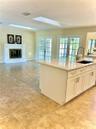Family Room Fireplace and French Doors and Skylights
