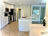 Island Kitchen /Dining Rm by  Front Windows