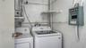 The laundry room is outside the door by the ramp