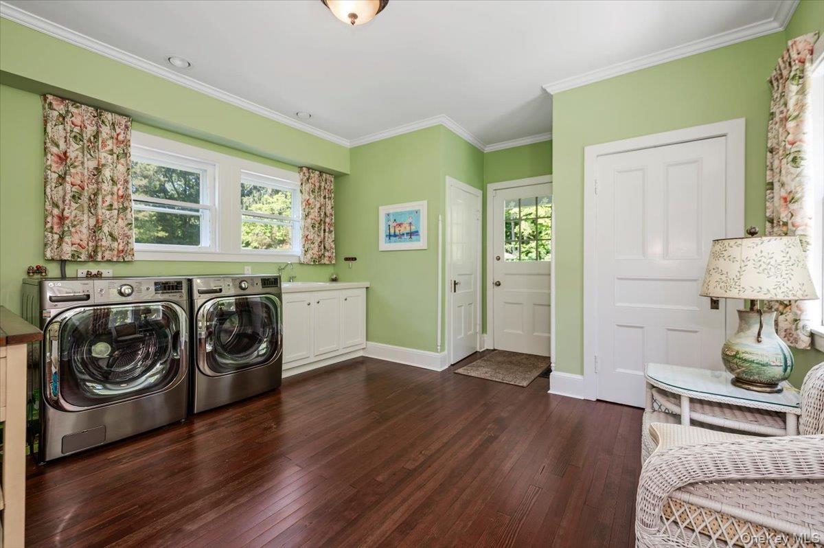 large laundry room, mudroom, storage closets, bathroom and side access