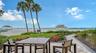 Enjoy the amazing sunsets year-round from the provided tables, chairs, and chaise lounges
