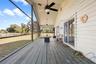 Cottage screened in wrap around porch.