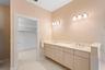 Master bath showing walk in closet.