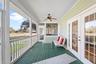 Back screened porch looking to sunroom.