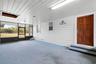 Screened breezeway between barn and cottage.