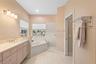 Master bath with handicapped shower.