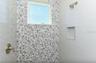Bedroom #3 en suite bathroom with walk in tile shower