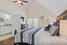 Top floor primary king bedroom with en-suite and private balcony