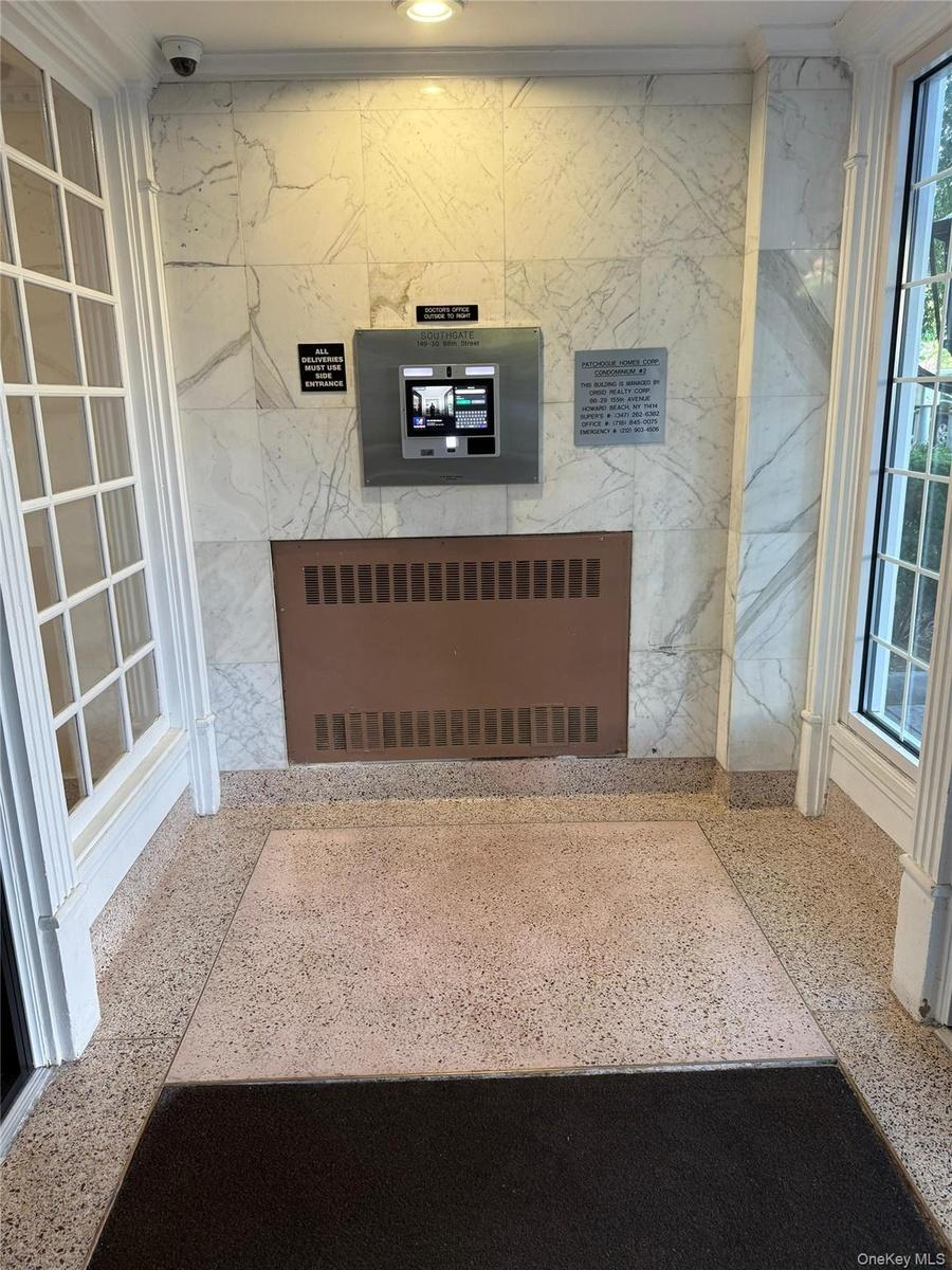 ENTRANCE TO BUILDING WITH SECURITY CAMERA AND DOORBELL