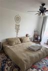 Large primary bedroom with ample space to comfortably accommodate a king-size bed.