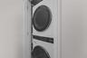 new stackable washer dryer in closet of front hallway conveniently located.