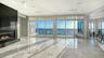 Living room with marble floors and fireplace