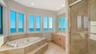 Primary bathroom with plenty of natural light