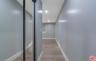 Hallway with closet in primary