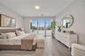 Bedroom featuring visible vents and wood finished floors