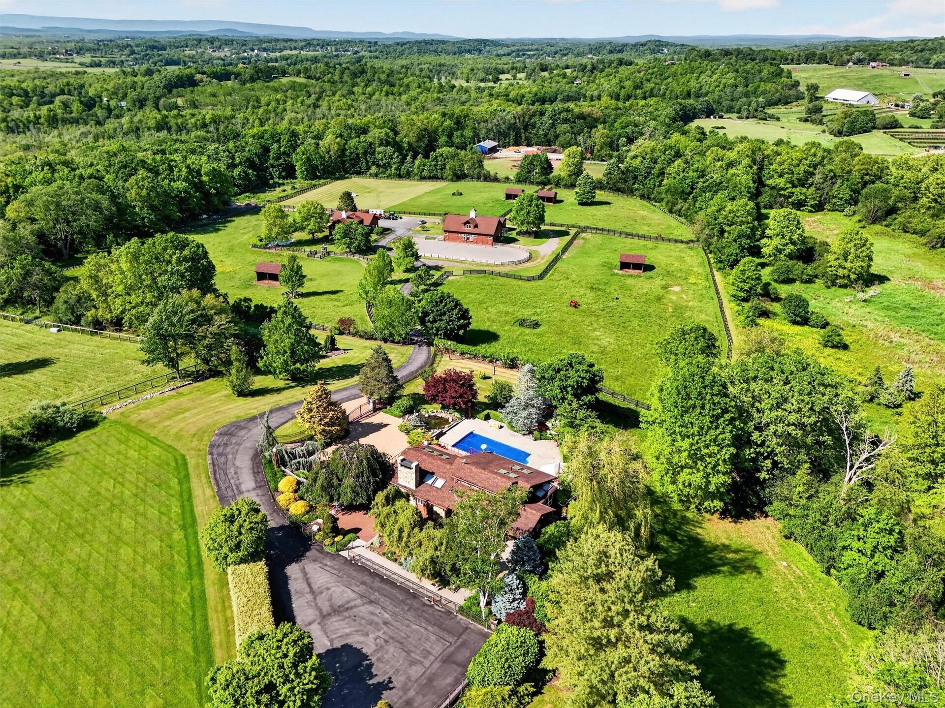 Set in a bucolic area of fine homes, the house has lovely views of the hills beyond the farm