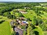 Set in a bucolic area of fine homes, the house has lovely views of the hills beyond the farm