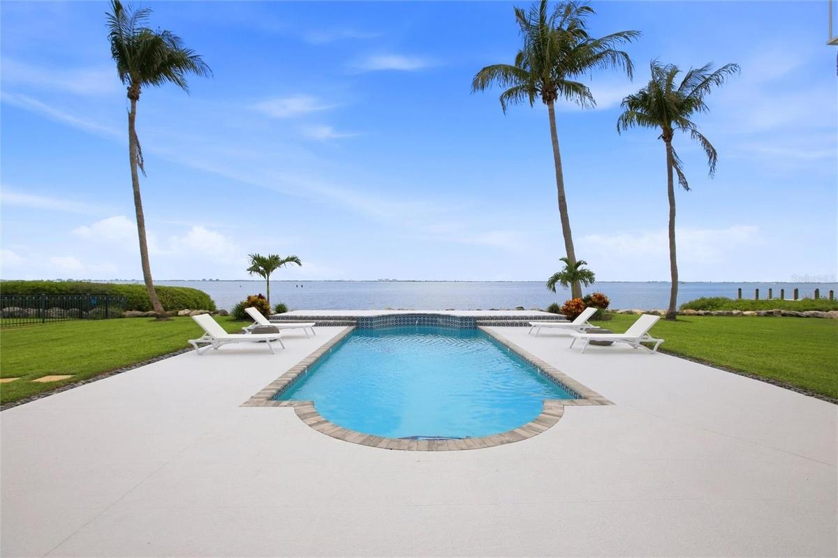 A view from the deck to the pool to the Sarasota Bay to Longboat Key and beyond.