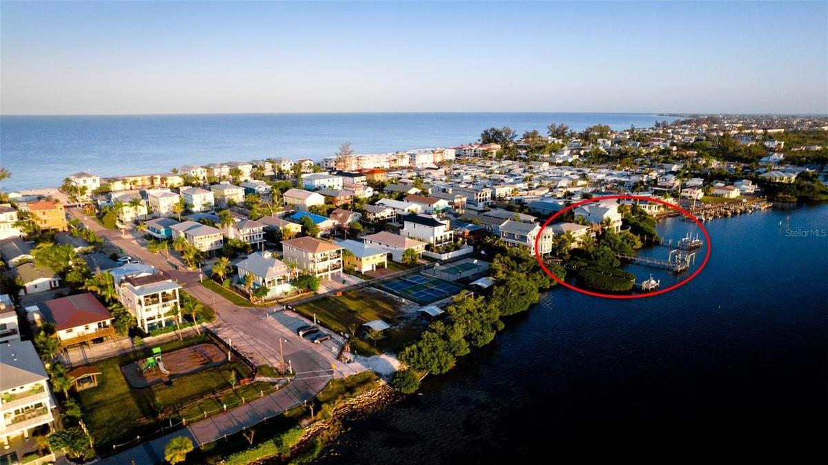 Panoramic Sarasota Bay views from one of the island's most exceptional waterfront parcels.
