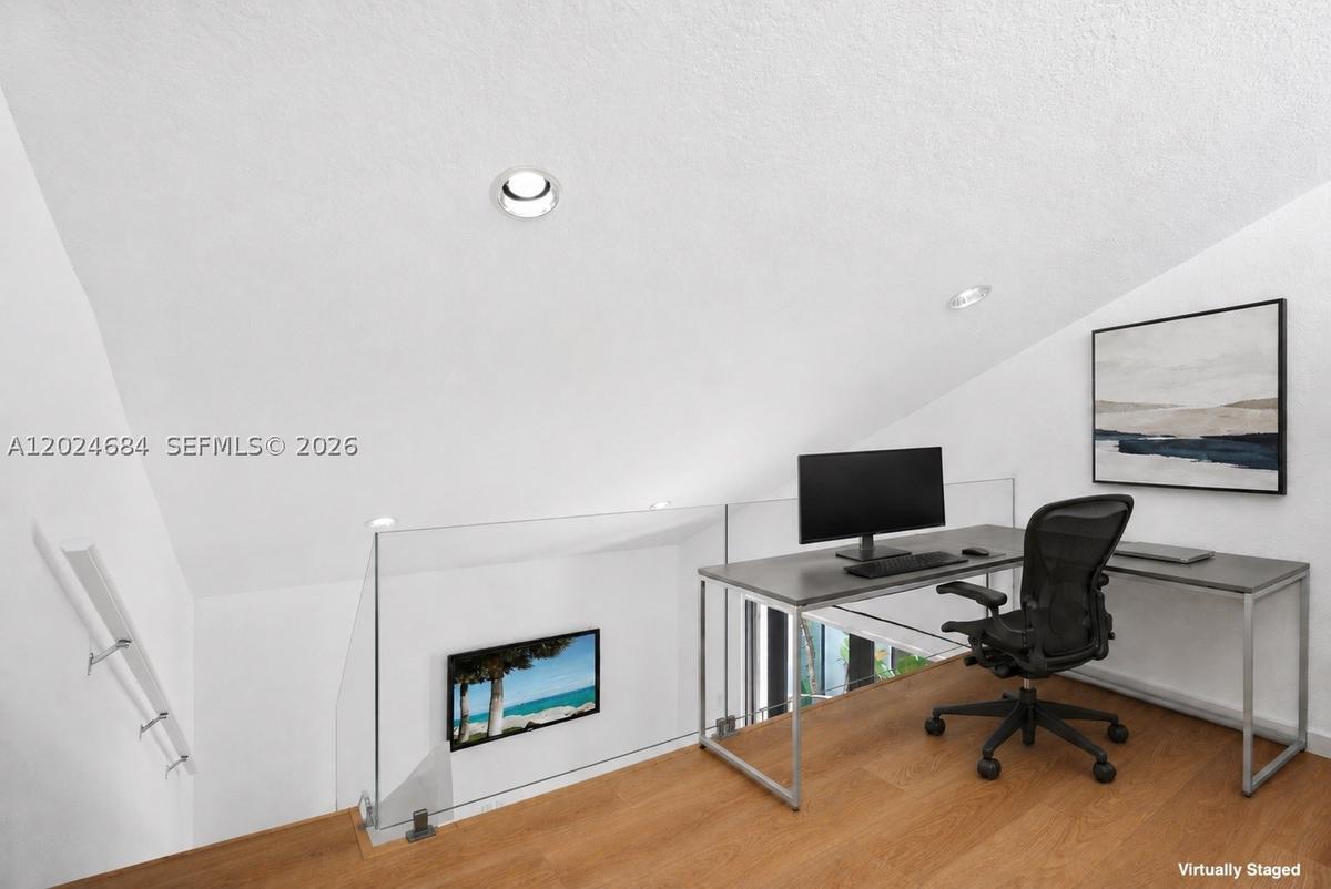 Loft is the perfect space for a home office. Plenty of space for large L-Shaped desk, filing cabinet(s), and bookshelf