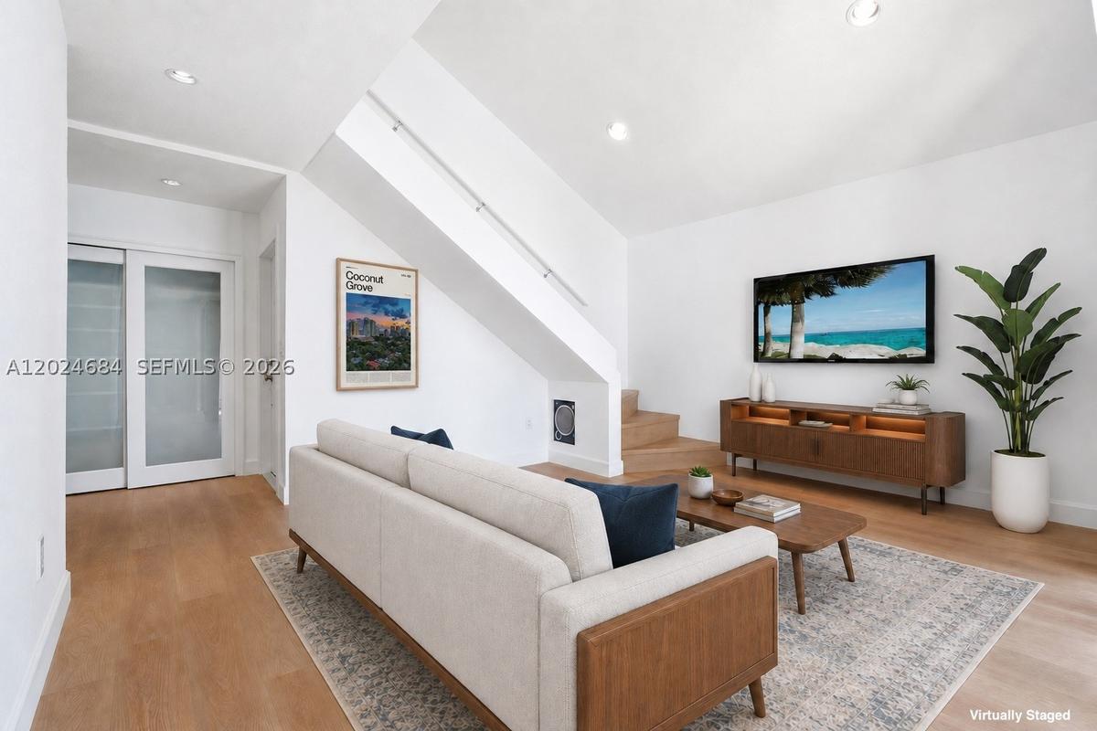 Sofa in this location leaves a hallway to Kitchen