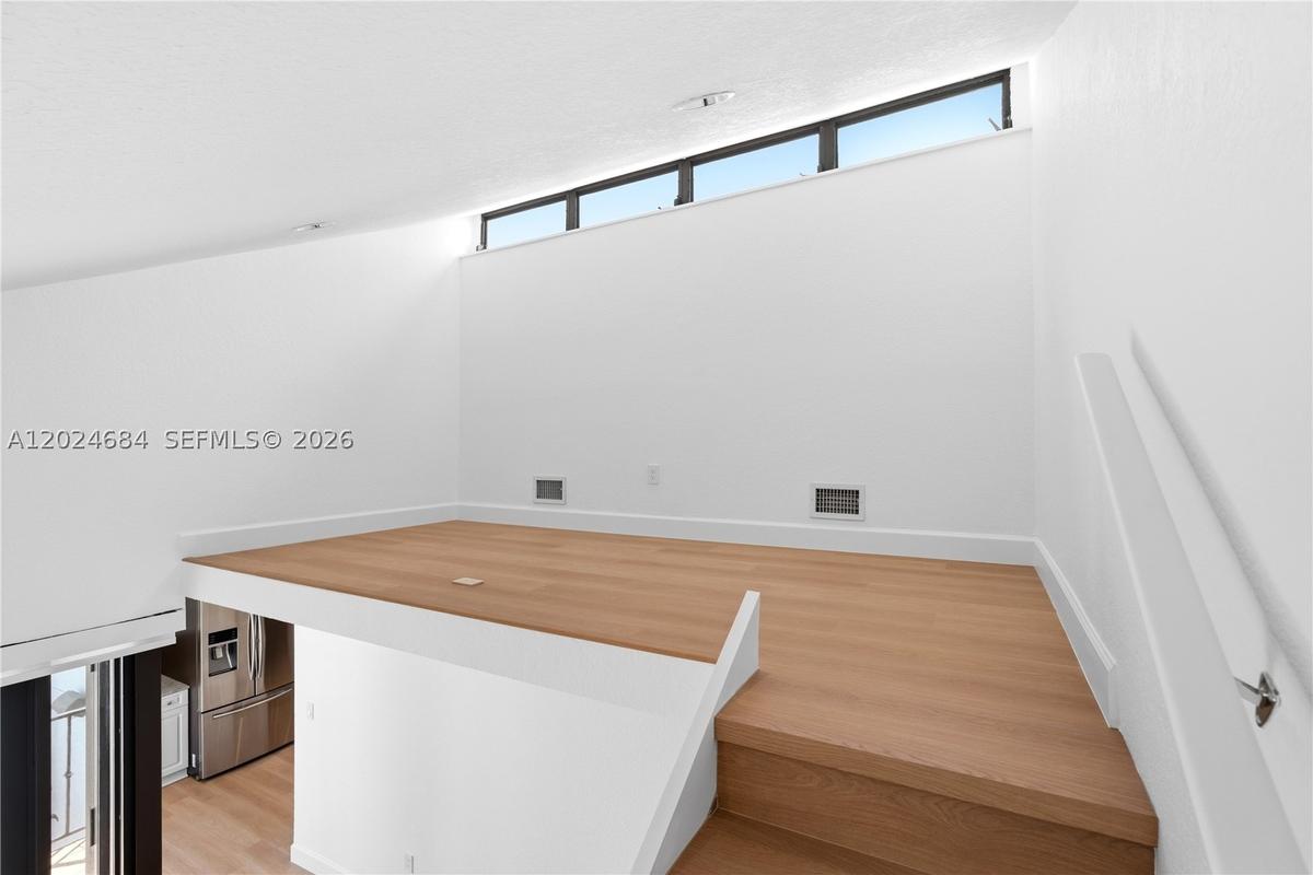 Loft is the perfect space for a home office. Plenty of space for large L-Shaped desk, filing cabinet(s), and bookshelf