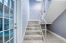 Stairway to Second Floor with Pool Area access and custom railing