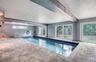 Indoor Pool Area with pavers and rear yard access