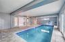 Indoor Pool Area with French Doors to Living Area open