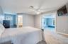 First Floor Primary Bedroom with En Suite and French Doors open to Pool Area
