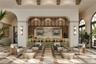 The Owner’s Lounge at Mira Mar features a beautifully designed gathering space with an elegant bar area offering residents a sophisticated setting to 