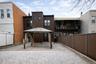 Rear view of house with a gazebo and a patio area