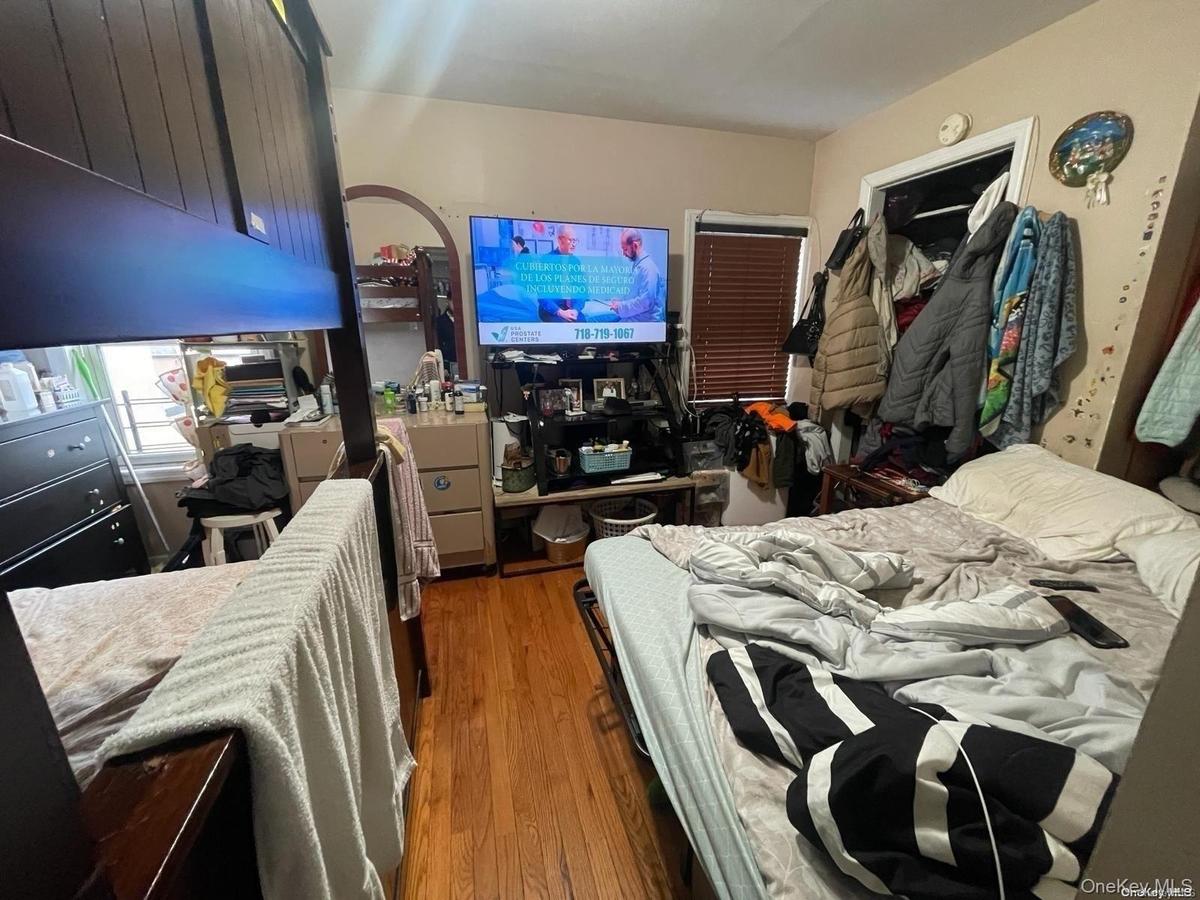 Bedroom with wood finished floors