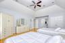 Bedroom featuring light wood-style floors, a ceiling fan, vaulted ceiling, and a closet