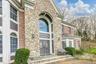 Doorway to property featuring stone siding