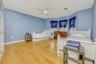 Bedroom with light wood-type flooring and a ceiling fan