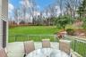 Deck featuring outdoor dining space and a lawn