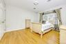 Bedroom featuring light wood-style floors and baseboards