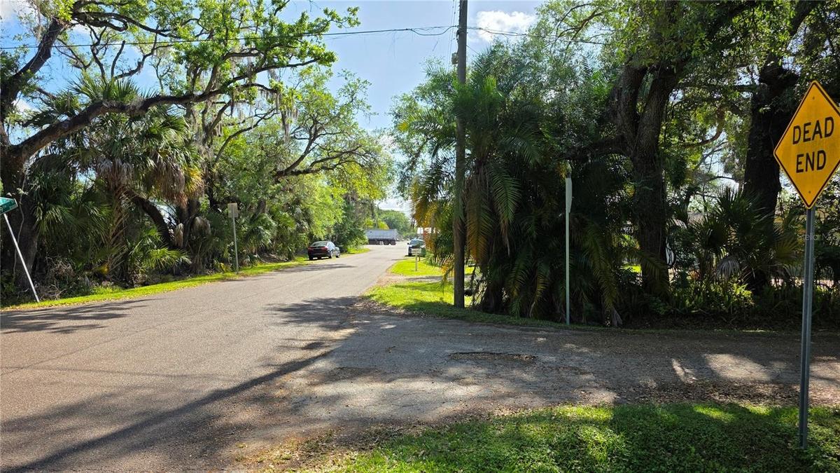 Looking East down 23rd Ave, back towards 50th Street.This is the back entrance to Lot A & also the entrance to Lot B.Turn South into DEAD END 49th Str
