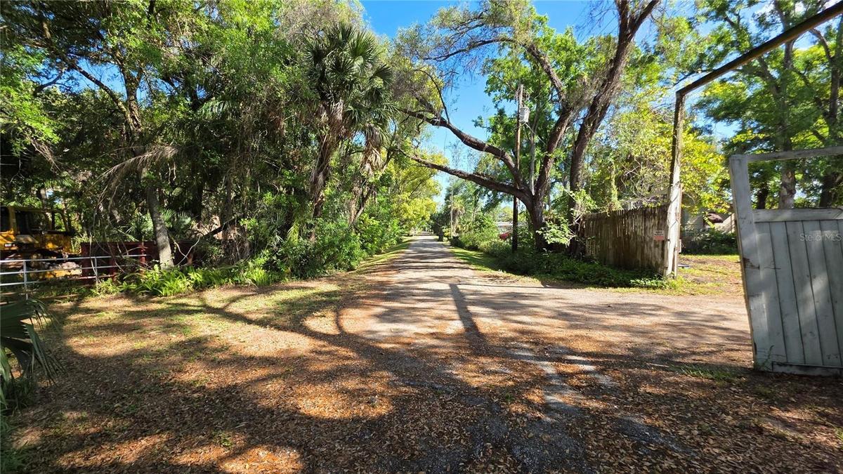 Between gates to Lot B on the LEFT & Lot A on the RIGHT.Looking North up 49th Street.