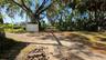 Back entrance into Lot A to the left.Also entrance into Lot B to the right.49th Street DEAD END is the Green Fence ahead.This is the back entrance to 