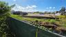 Looking over the Green Fence at end of 49th Street cul-de-sac.ZONING CONSIDERATION: In 2005, this Southerly neighboring commercial lot (046606 - see p