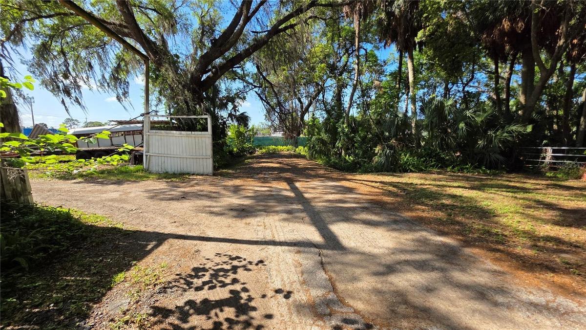 Back entrance into Lot A to the left.Also entrance into Lot B to the right.49th Street DEAD END is the Green Fence ahead.