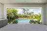 Outside living room with full kitchen overlooks pool