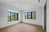 Second floor bedroom has huge window box seat