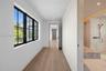 From second floor media room into the primary bedroom